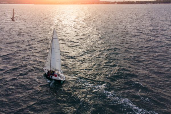 sailing yachts regatta race on sea aerial view at sunset
